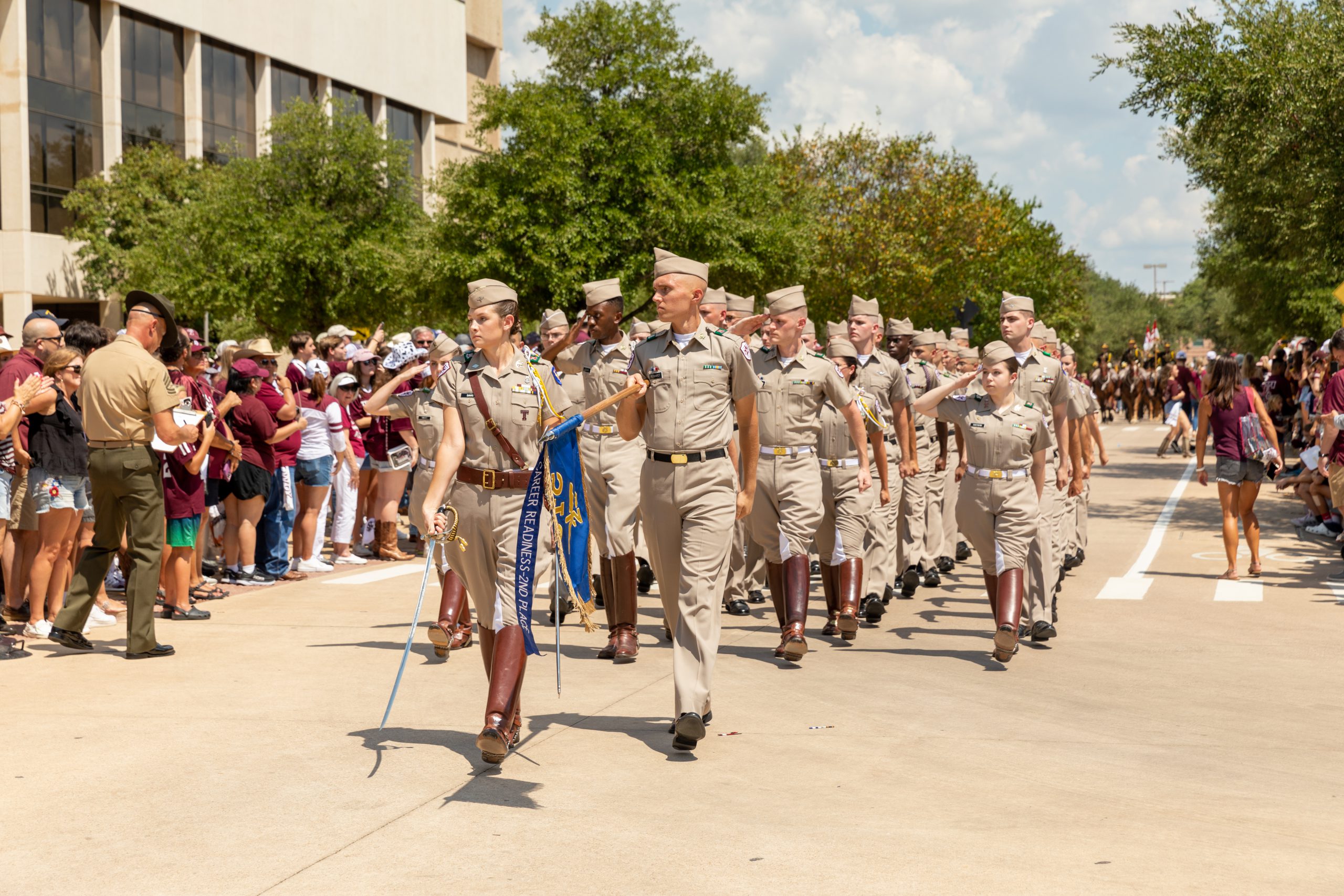 Cadets march past the Memorial Student Center
