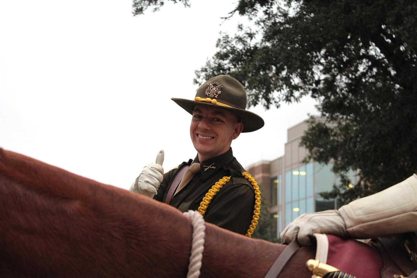Josh Palinkas '24 smiles in his Cav uniform while riding a horse