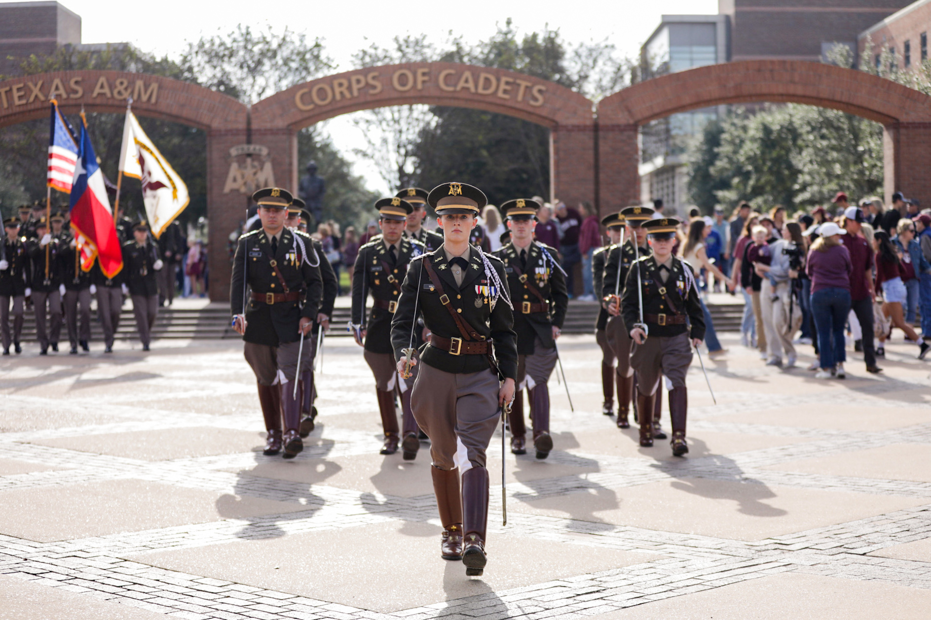 Cadets march out of the arches on the Corps Quad.