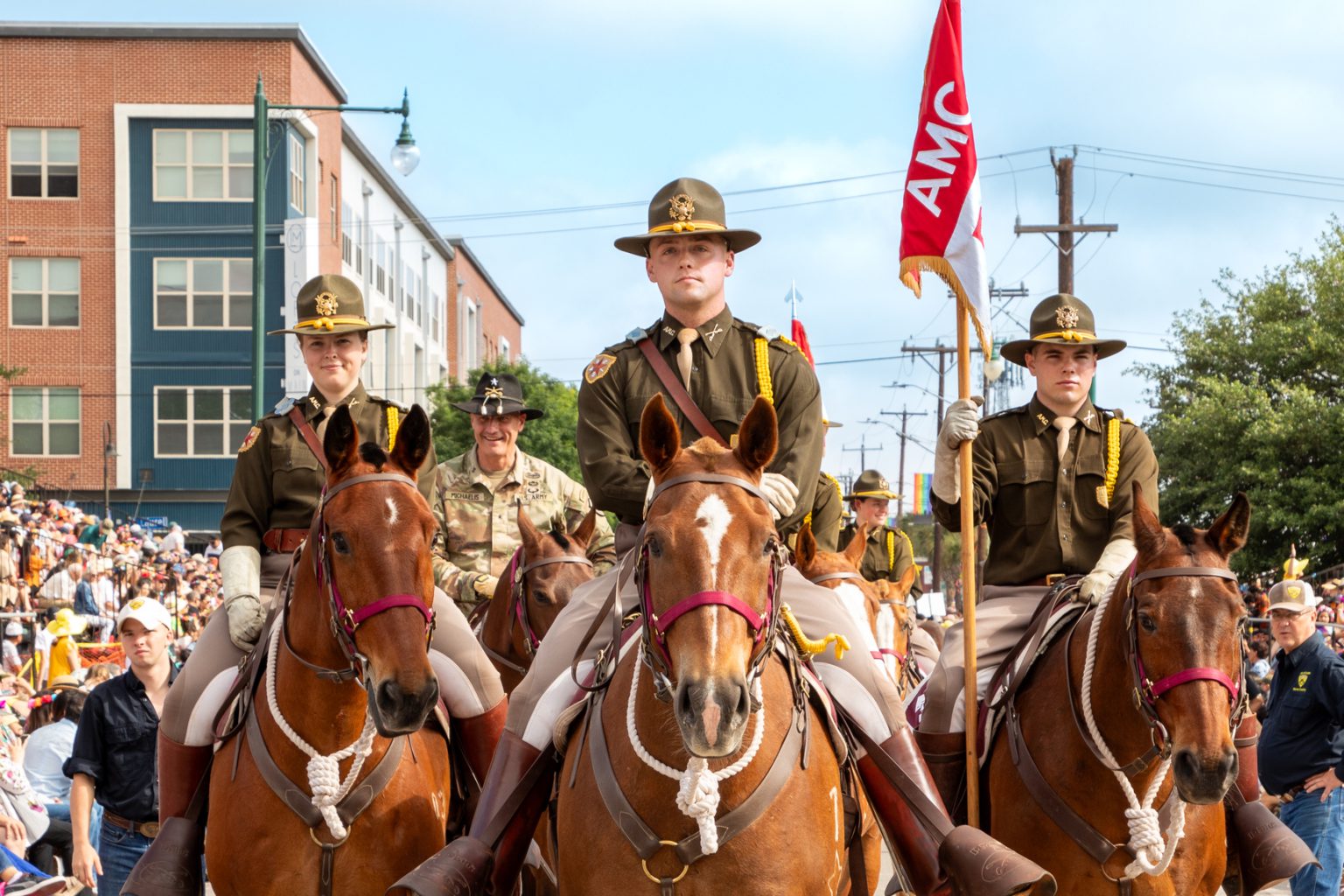 Three cadets on horses.