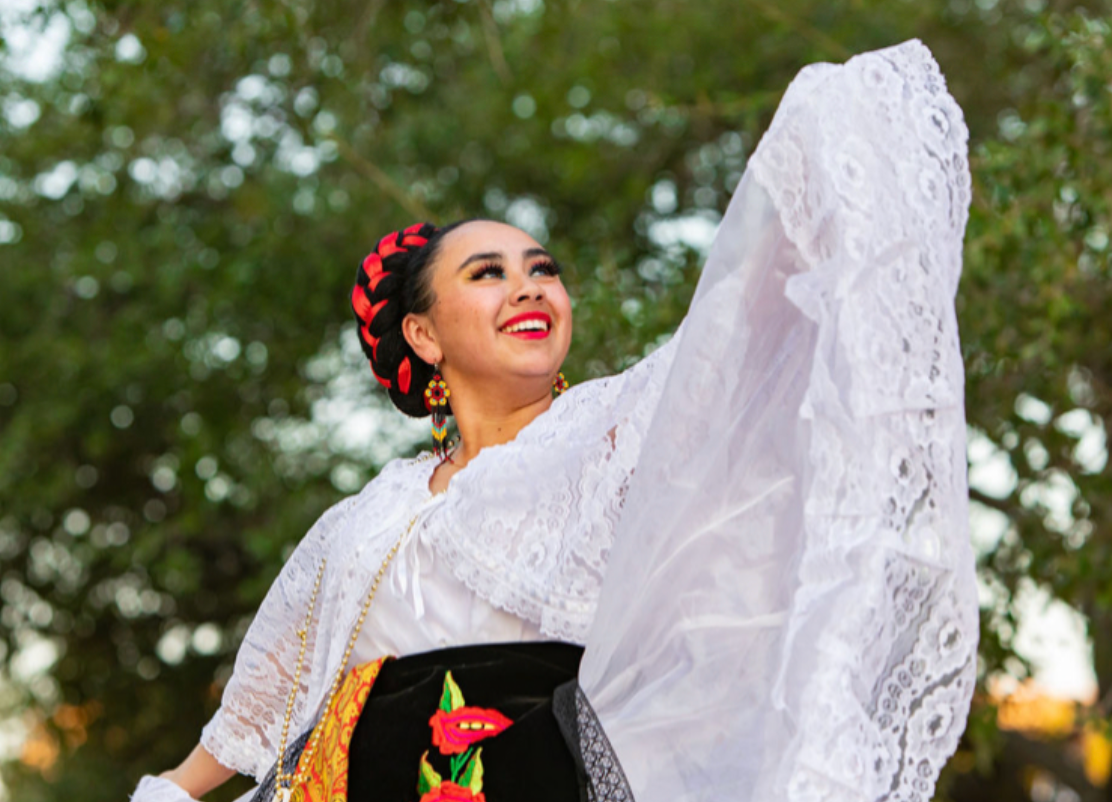 A women dressed in folklorico clothes