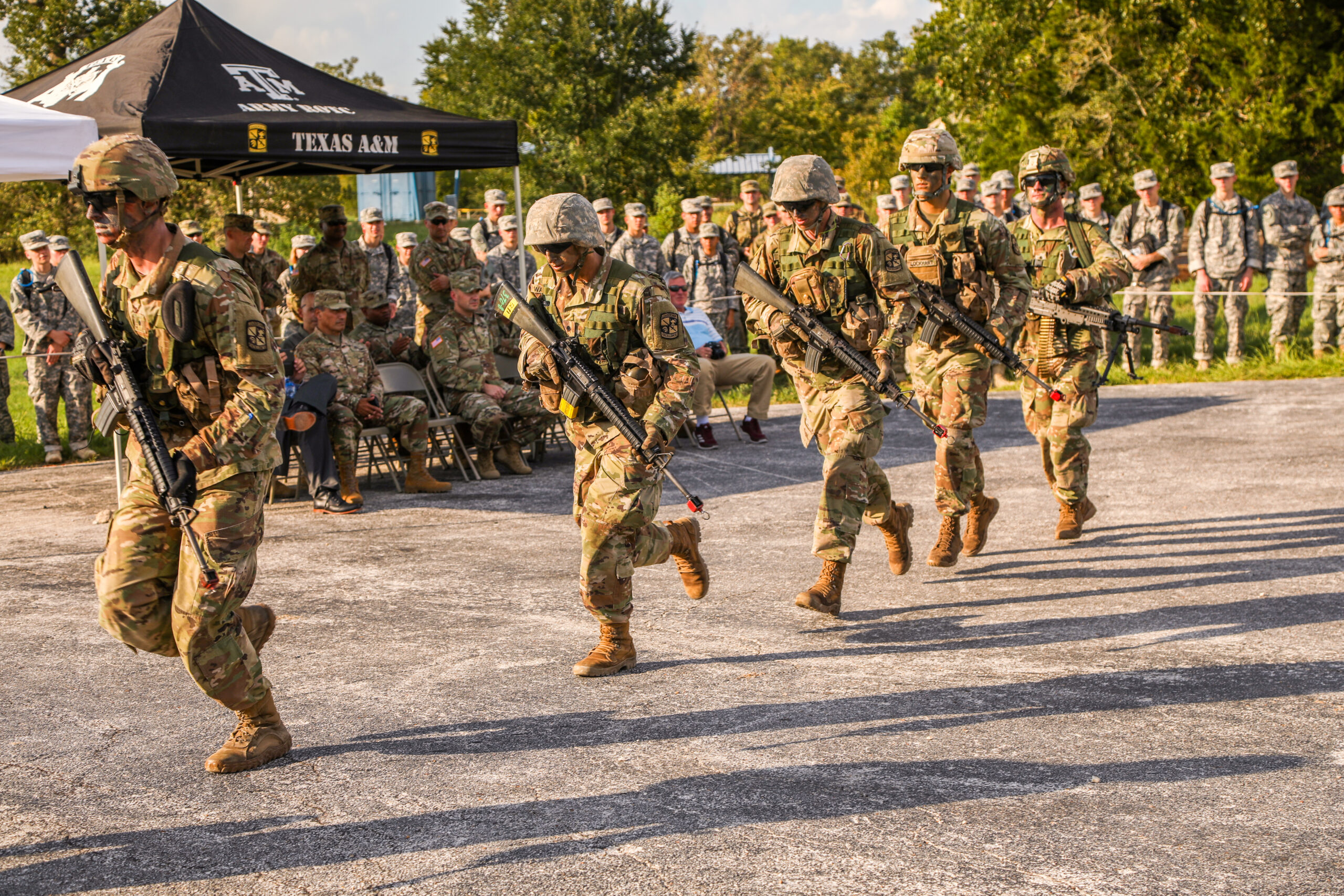 Cadets running with guns.