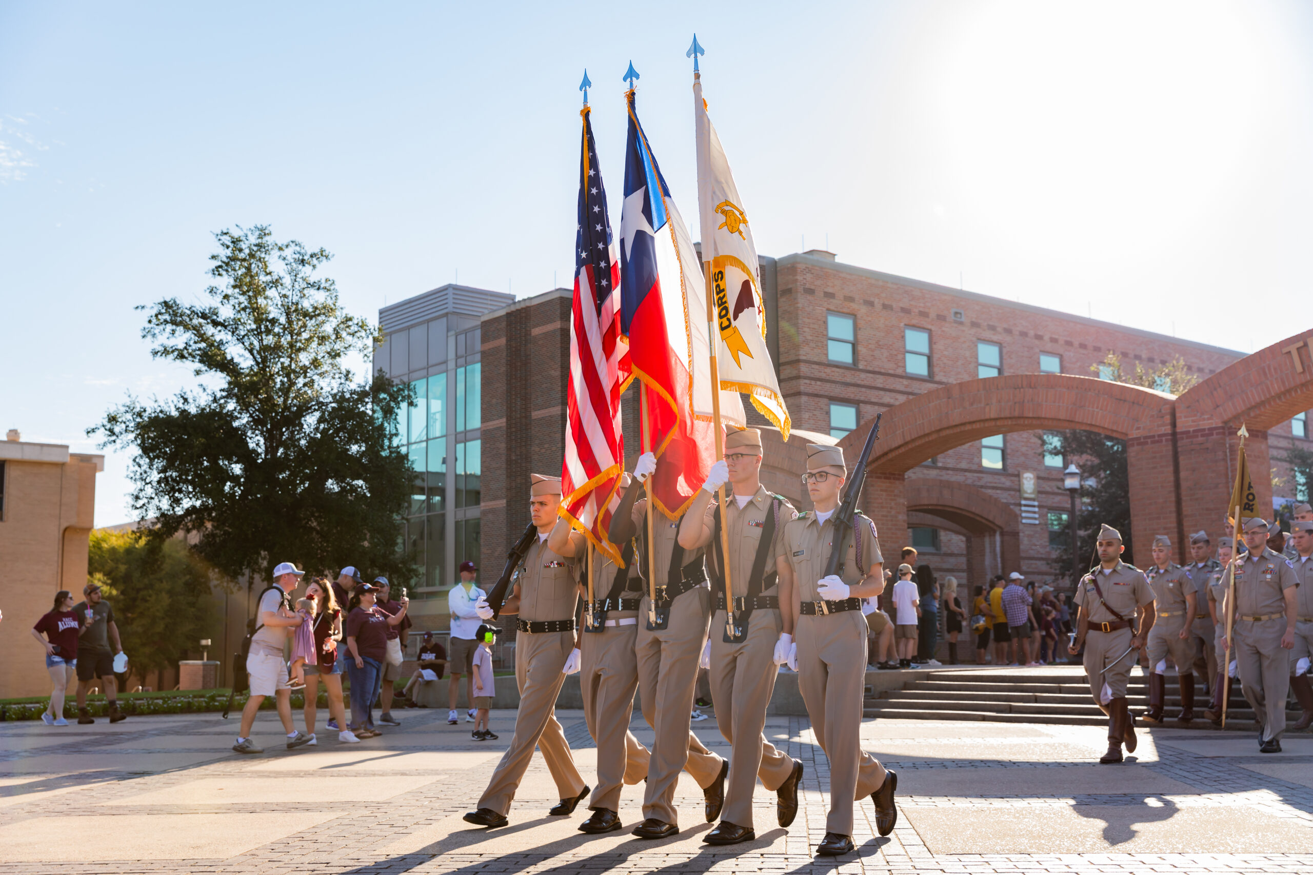 Cadets walking with flags.