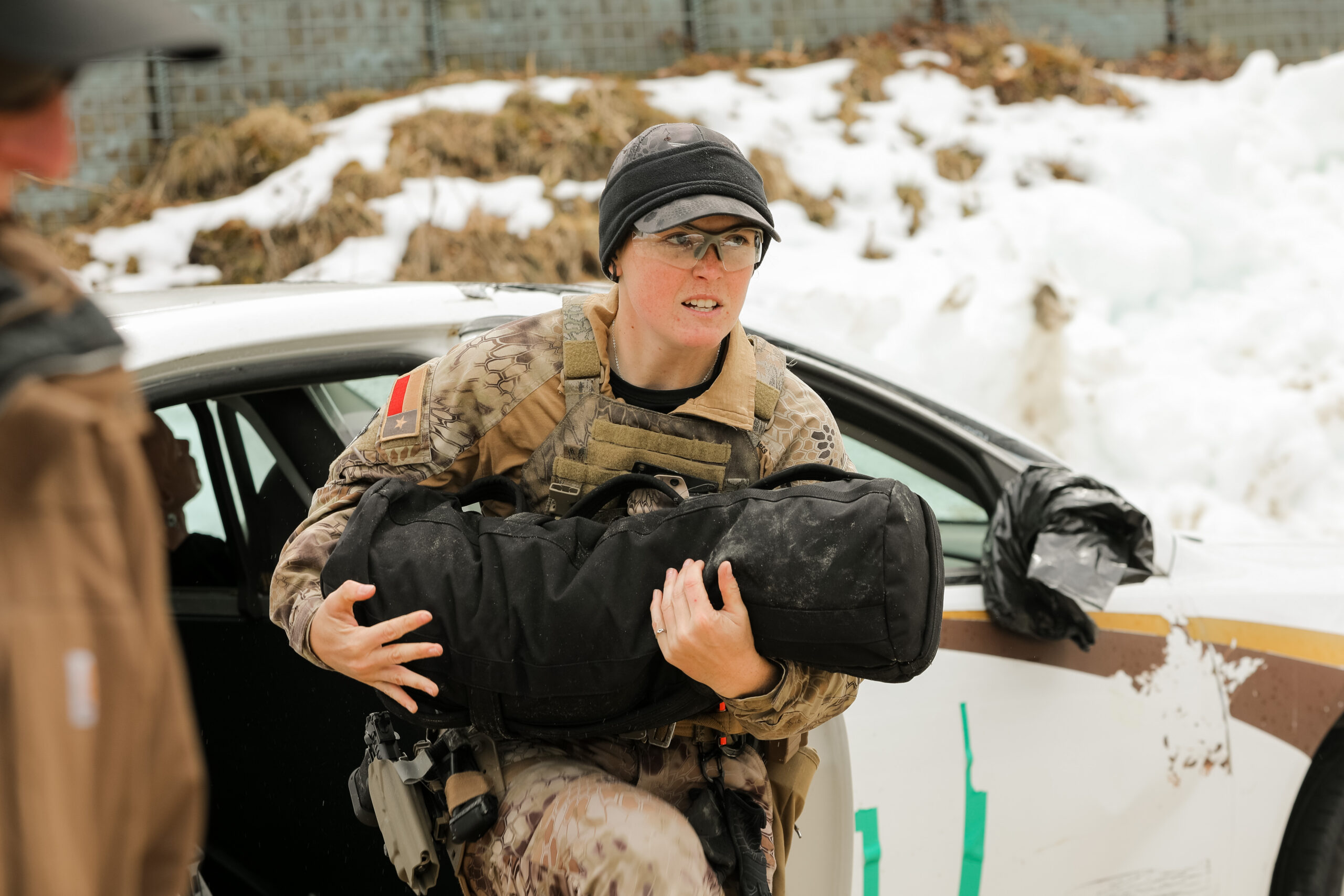 Ayla Myrin '24 runs an obstacle at a shooting match