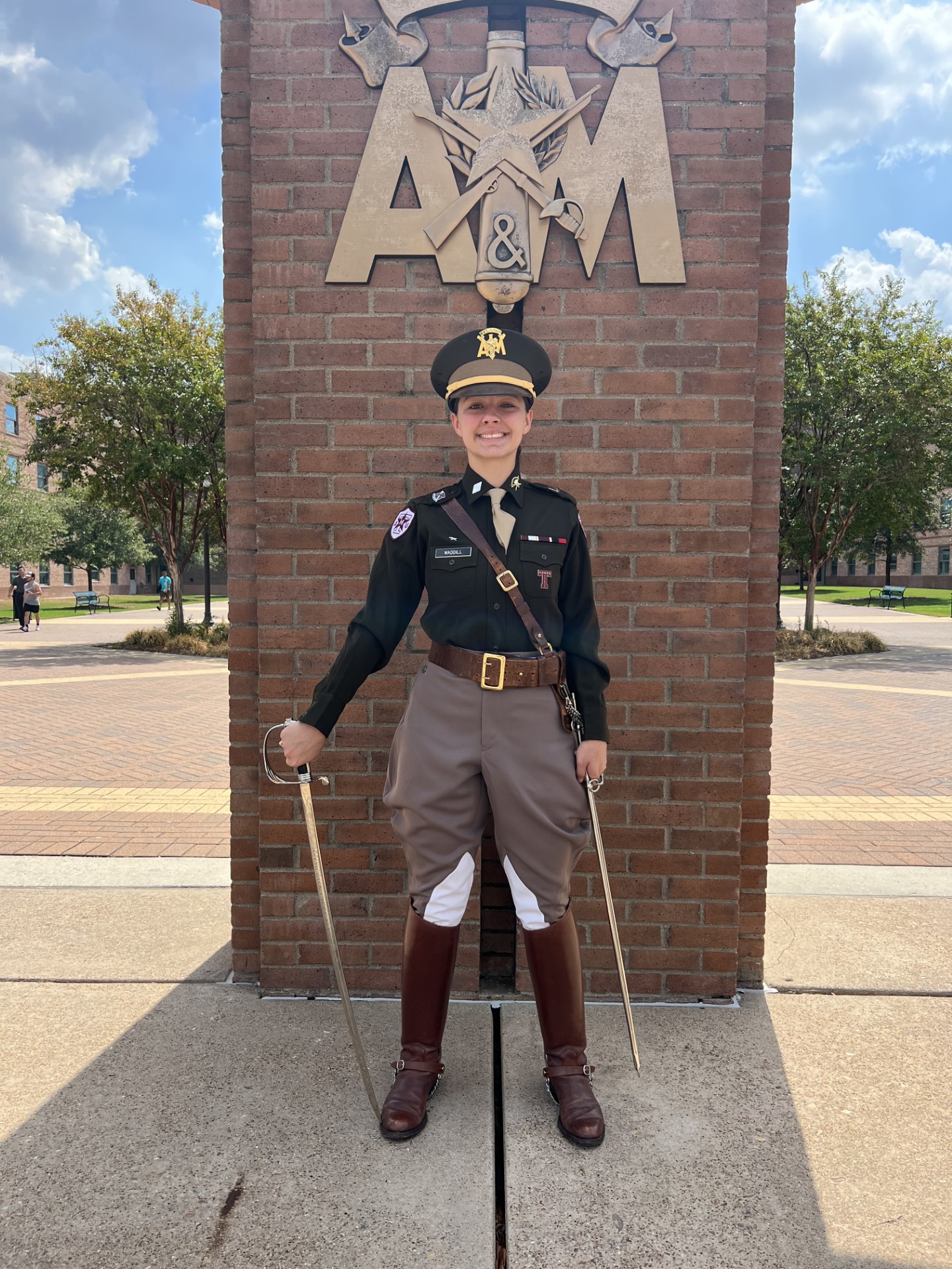 Anika Waddell '24 stands in front of the arches